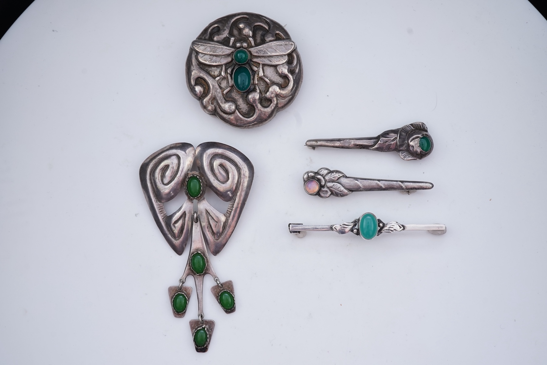 A collection of five Arts & Crafts silver brooches, Denmark, early-mid 20th century